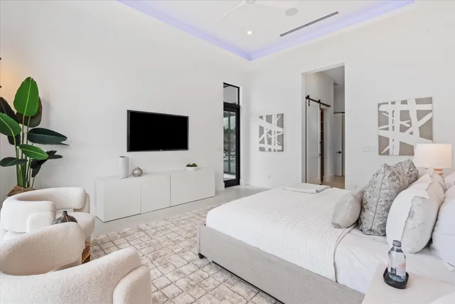 a view of staircase with railing and a chandelier