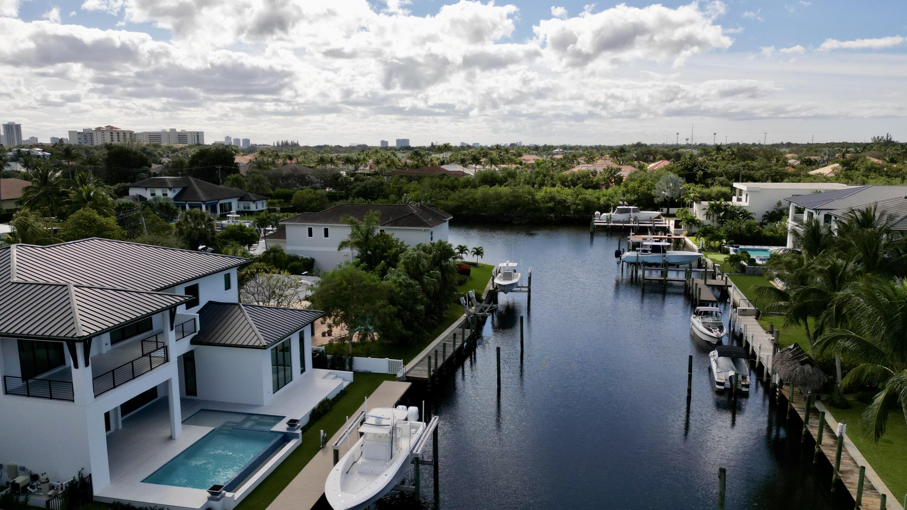 11331 Avery Road Palm Beach Gardens, FL 33410 - Photo 27 of 110 a view of a balcony with chairs and wooden floor