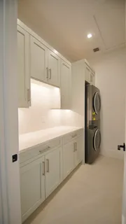 a bathroom with a shower a toilet and sink