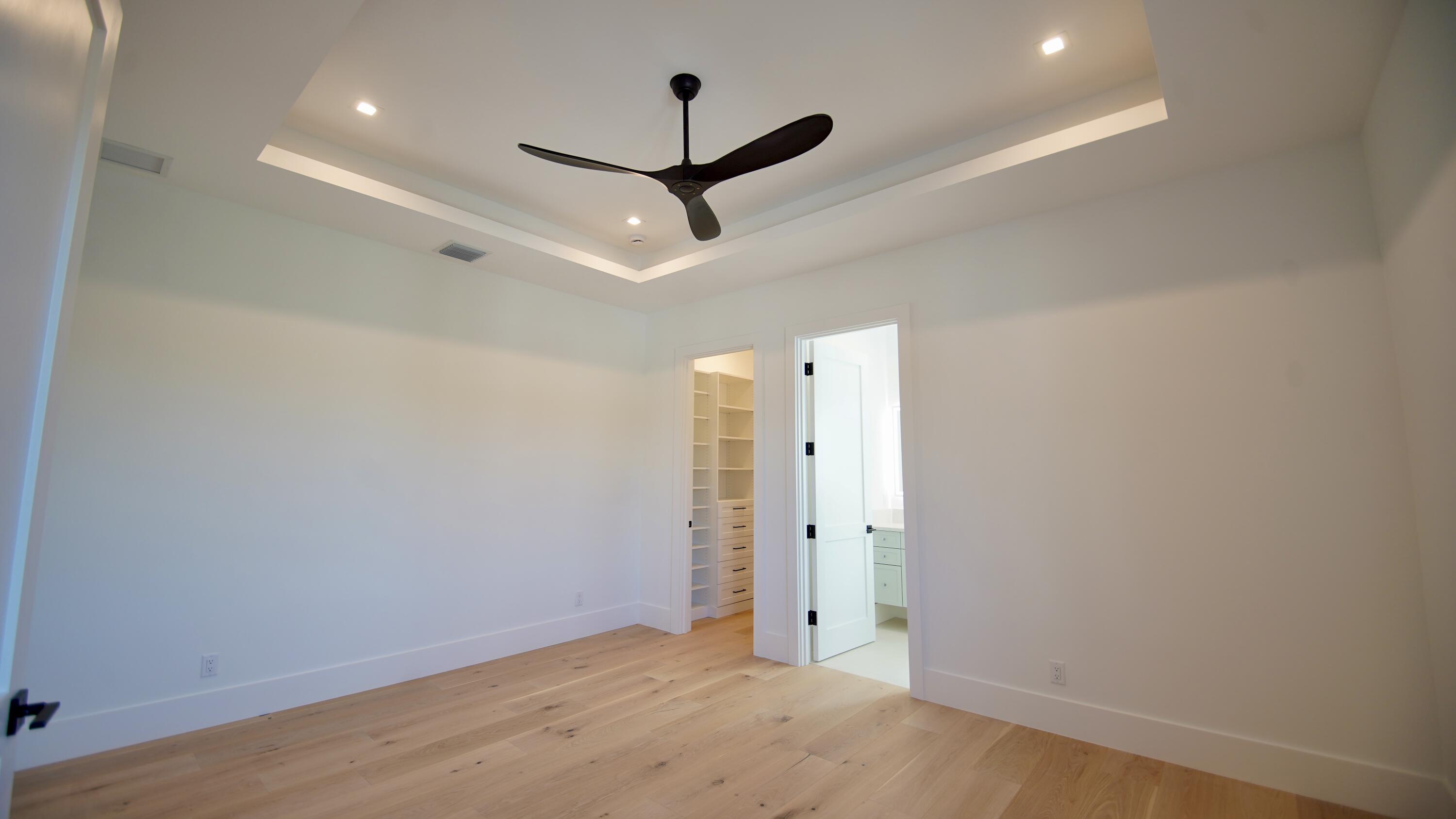 11331 Avery Road Palm Beach Gardens, FL 33410 - Photo 43 of 110 an empty room with closet and a ceiling fan