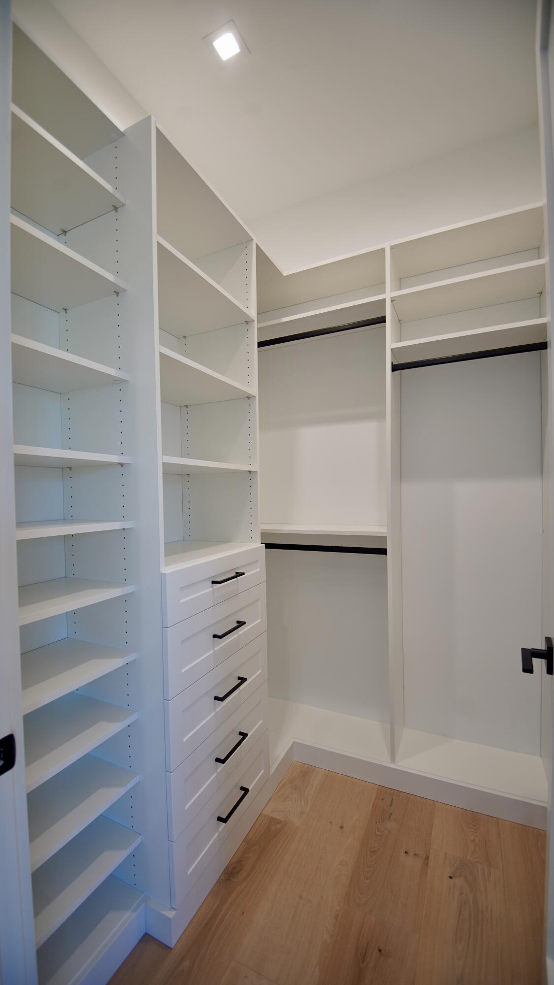 11331 Avery Road Palm Beach Gardens, FL 33410 - Photo 49 of 110 a view of walk in closet with empty racks