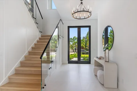 a large kitchen with a table and chairs