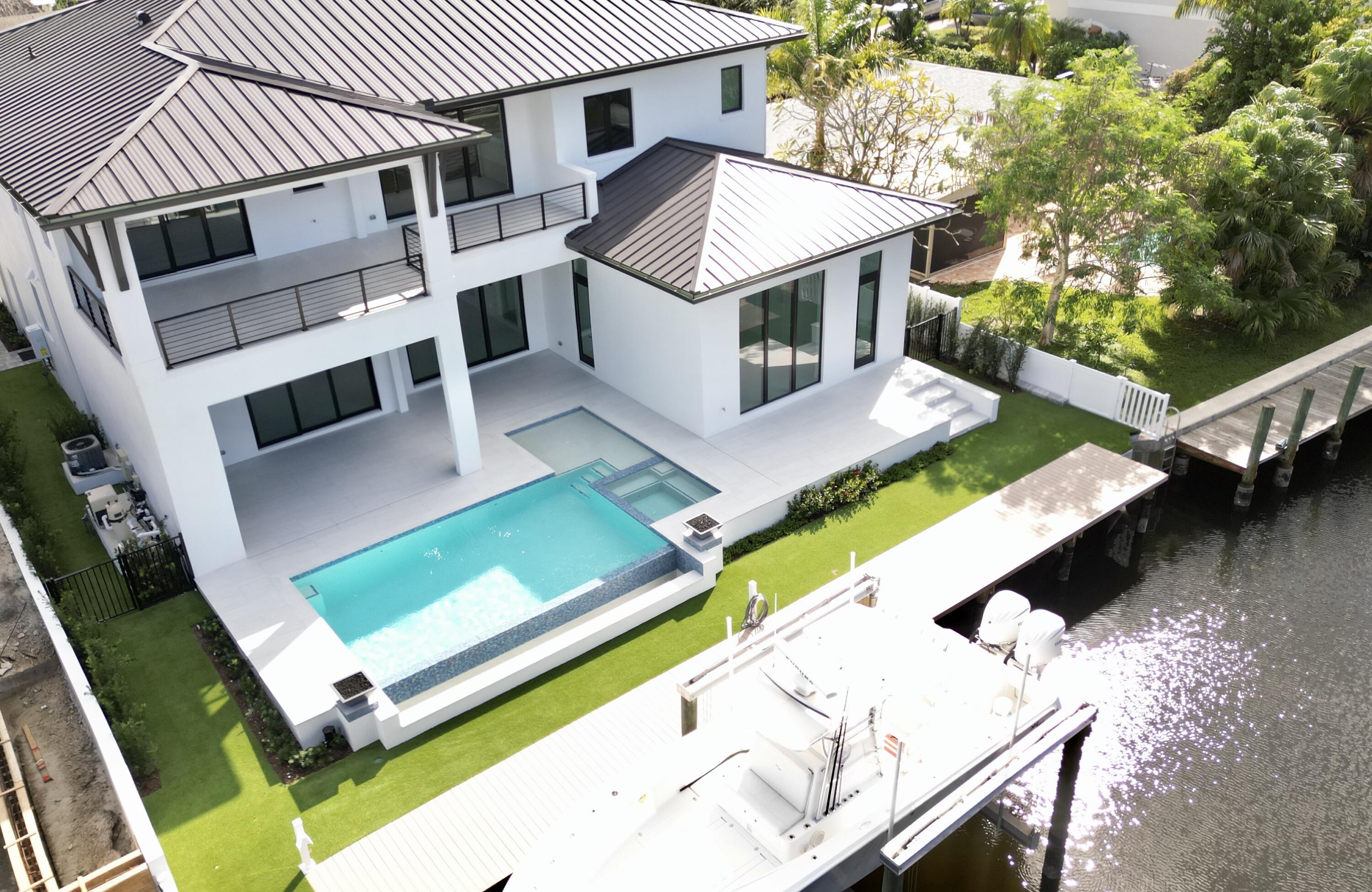 11331 Avery Road Palm Beach Gardens, FL 33410 - Photo 96 of 110 an aerial view of a house with pool