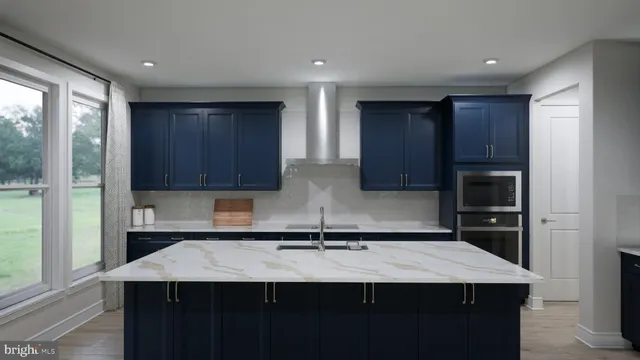 a kitchen with a sink a counter space and a window