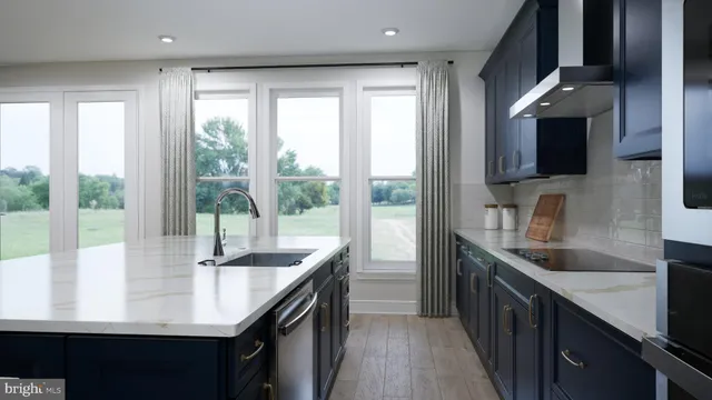 a kitchen with granite countertop a sink and a counter top space
