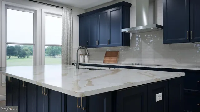 a kitchen with a sink a window and cabinets