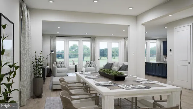 a living room with furniture and large windows