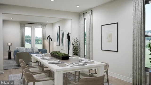 a view of a dining room with furniture and a table