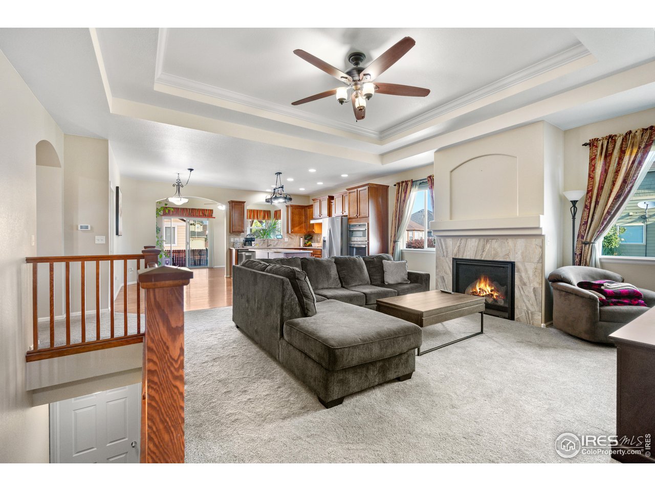 5865 Quarry Street Timnath, CO 80547 - Photo 13 of 47 a living room with furniture and a fireplace