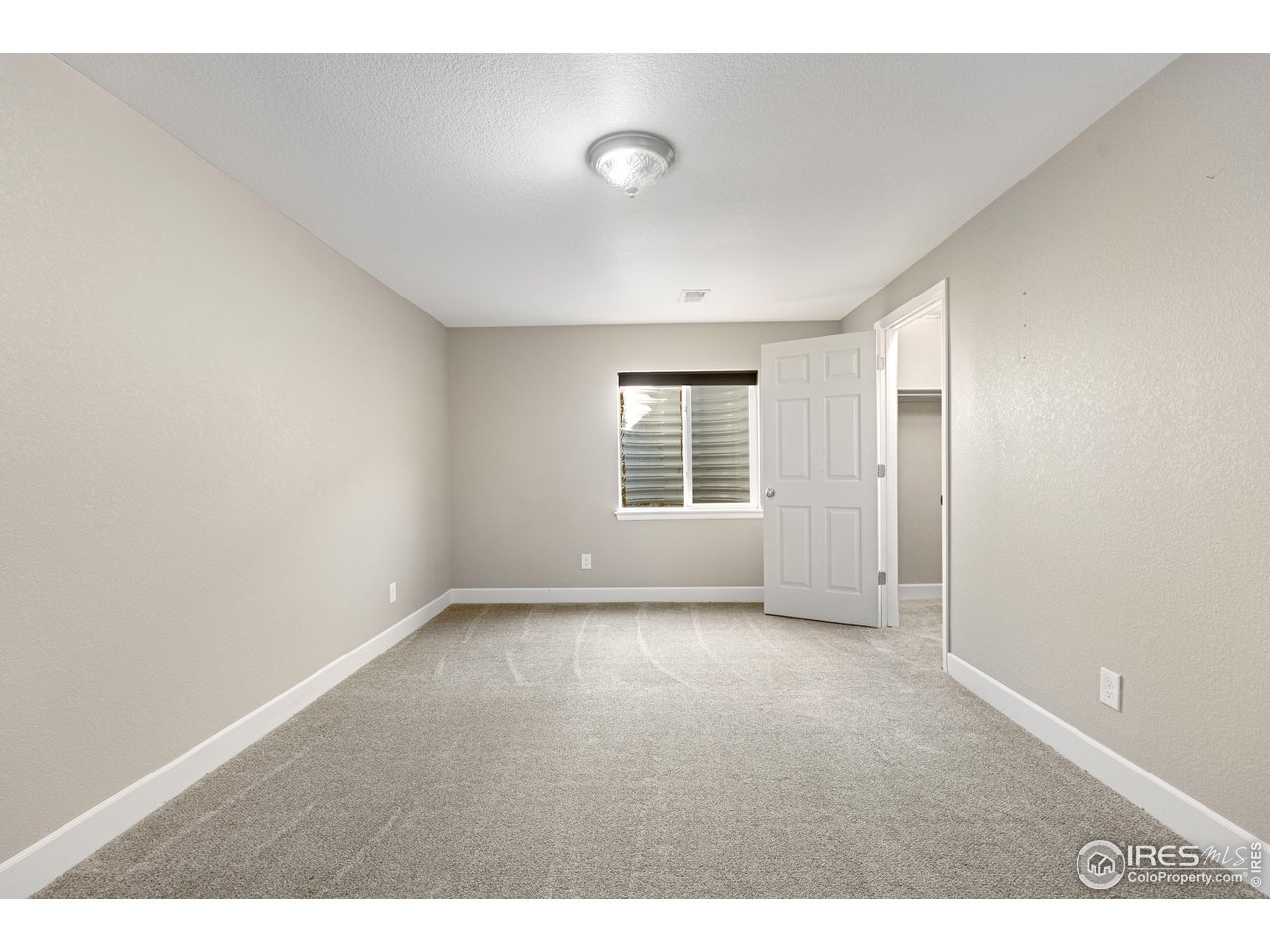 5865 Quarry Street Timnath, CO 80547 - Photo 19 of 47 an empty room with windows