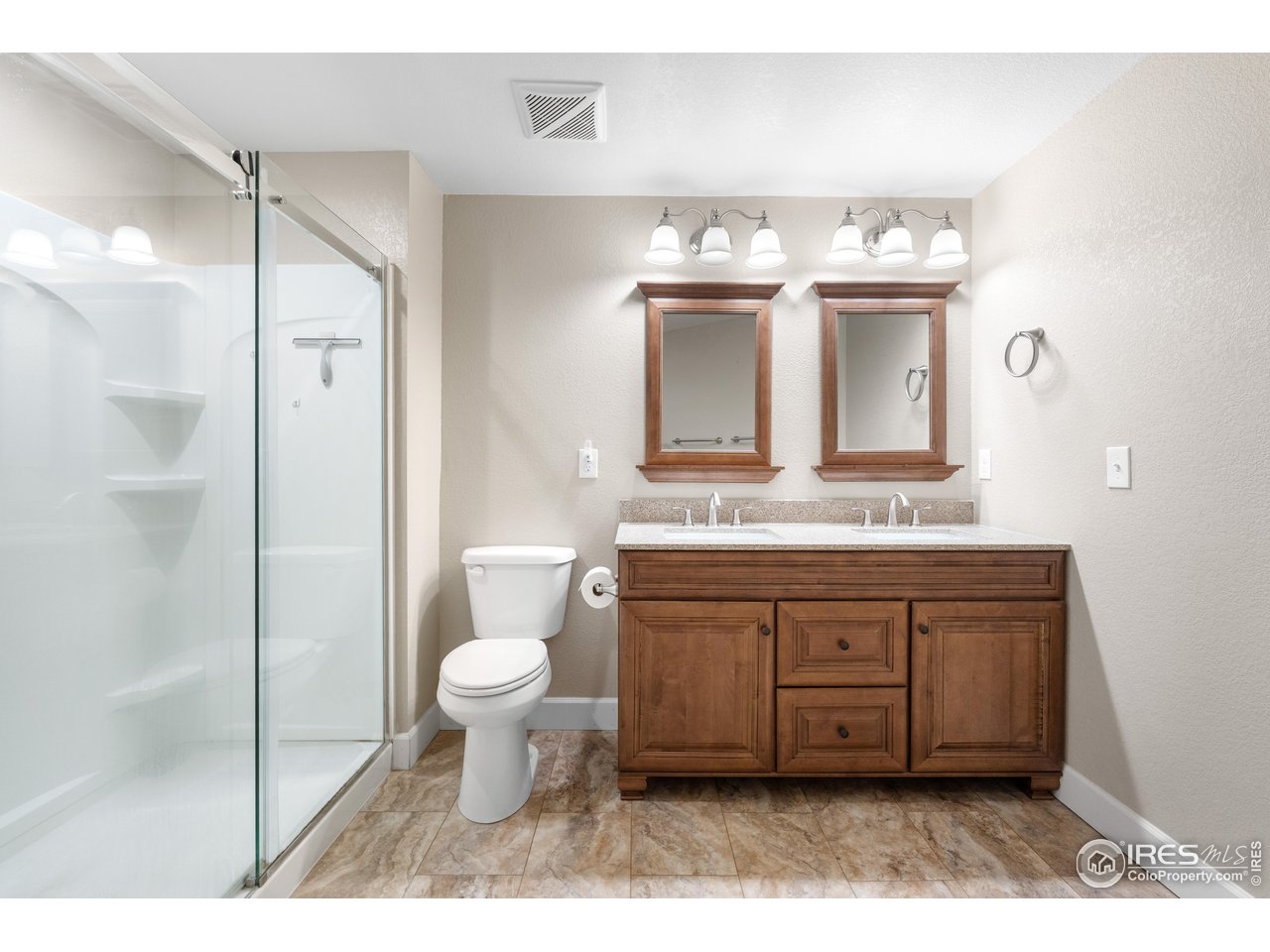 5865 Quarry Street Timnath, CO 80547 - Photo 20 of 47 a bathroom with a sink vanity mirror and toilet