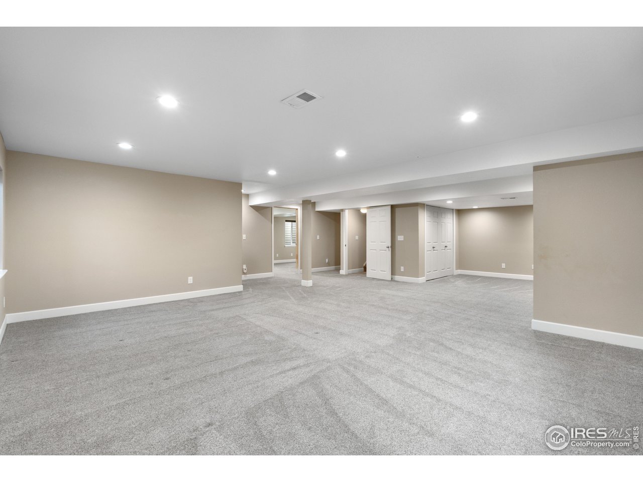 5865 Quarry Street Timnath, CO 80547 - Photo 29 of 47 a view of an empty room with wooden floor