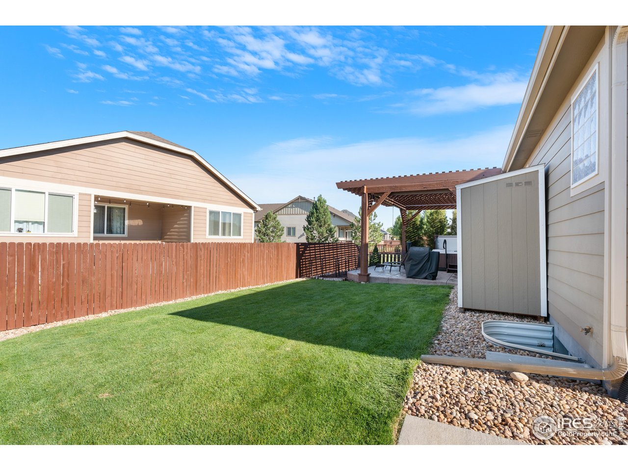 5865 Quarry Street Timnath, CO 80547 - Photo 33 of 47 a backyard of a house with lots of green space