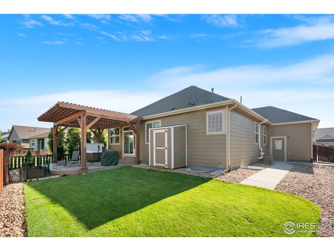 5865 Quarry Street Timnath, CO 80547 - Photo 34 of 47 a backyard of a house with yard and outdoor seating