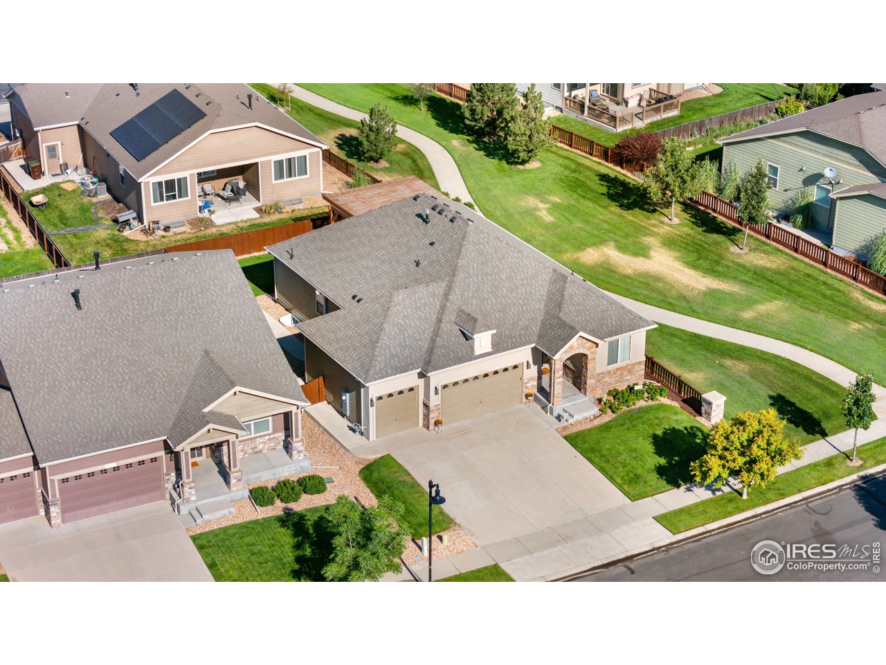 5865 Quarry Street Timnath, CO 80547 - Photo 36 of 47 a aerial view of a house with a garden and a yard