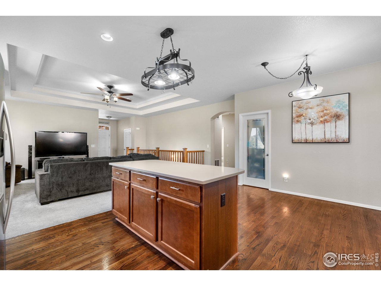 5865 Quarry Street Timnath, CO 80547 - Photo 7 of 47 a view of a kitchen center island and stainless steel appliances