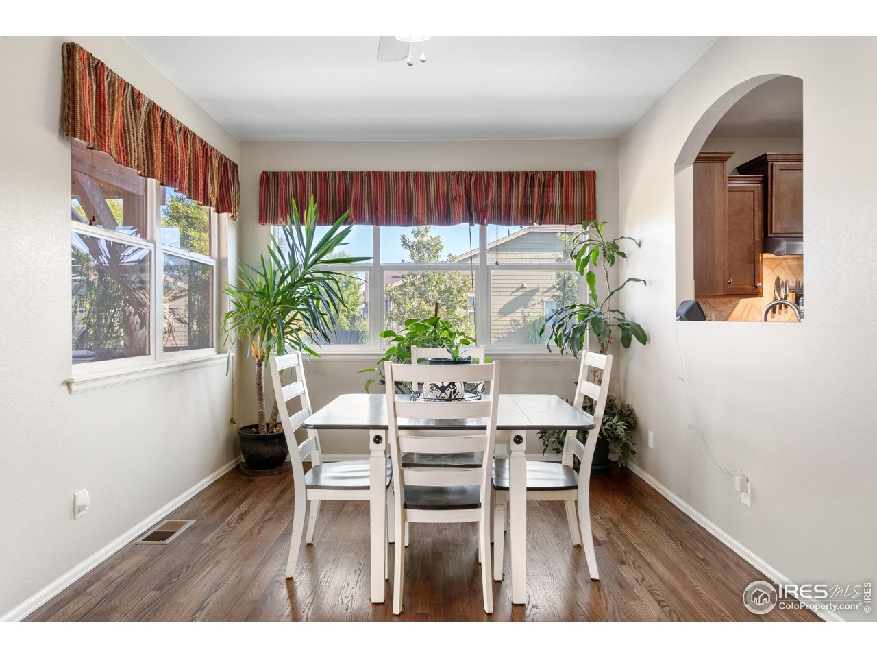5865 Quarry Street Timnath, CO 80547 - Photo 8 of 47 a dining room with furniture and a large window