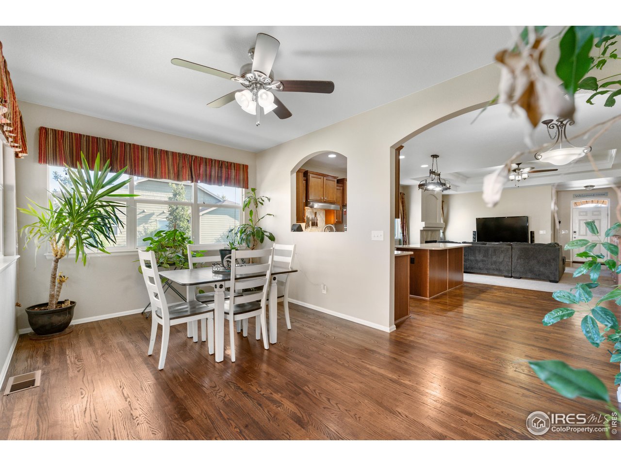 5865 Quarry Street Timnath, CO 80547 - Photo 10 of 47 a view of a dining room with furniture and a chandelier