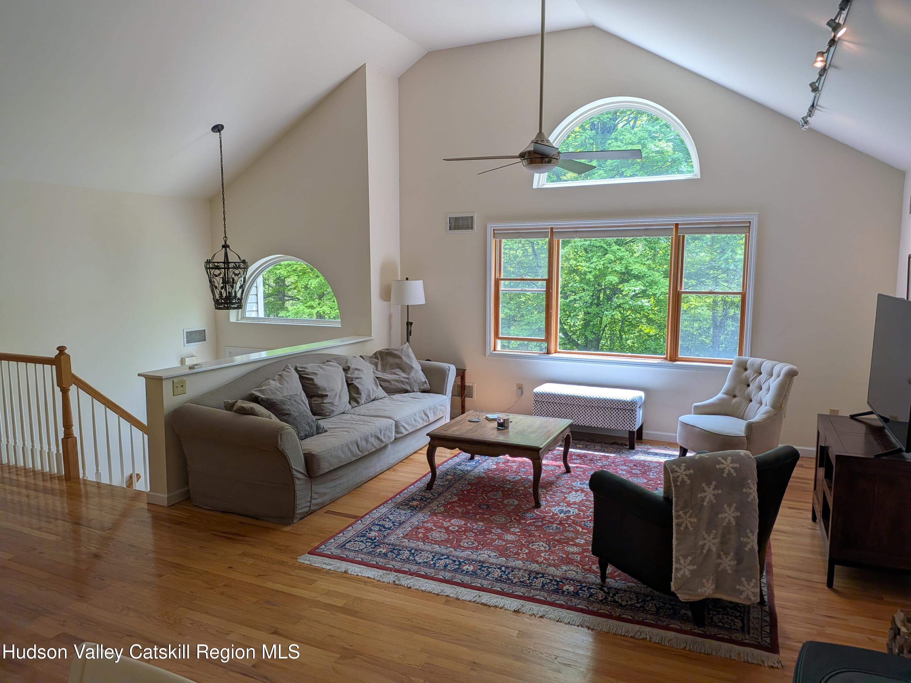 513 South Mountain Road Gardiner, NY 12525 - Photo 6 of 63 a living room with furniture chandelier and a large window