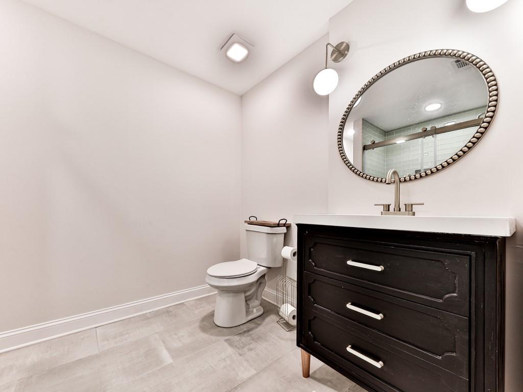 1141 Addington Lane Waleska, GA 30183 - Photo 13 of 105 a bathroom with a toilet a sink and mirror