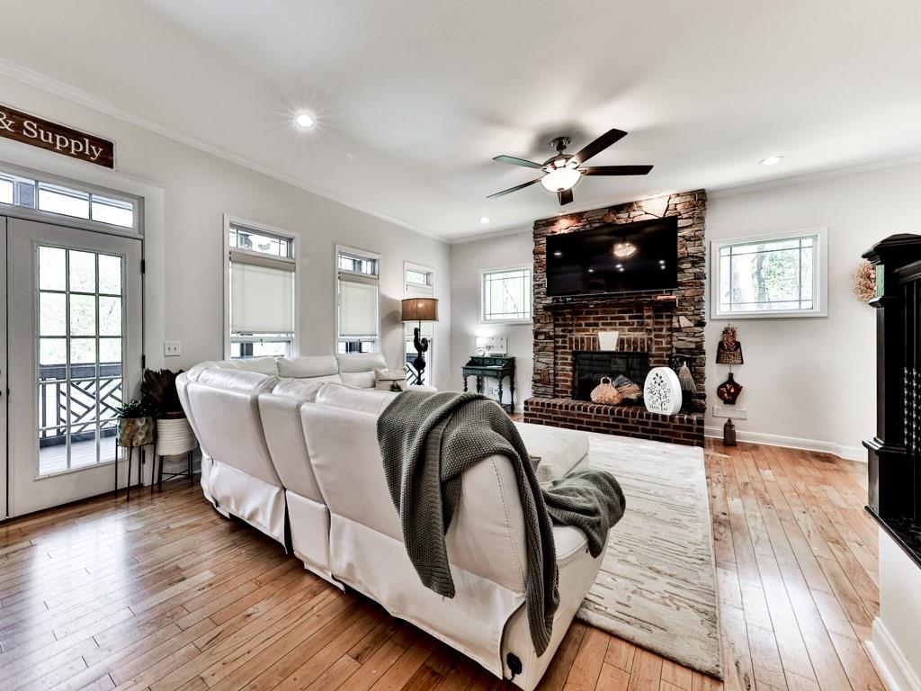 1141 Addington Lane Waleska, GA 30183 - Photo 18 of 105 a living room with furniture a flat screen tv and a fireplace