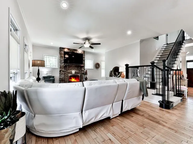 a bathroom with a granite countertop sink mirror and a shower
