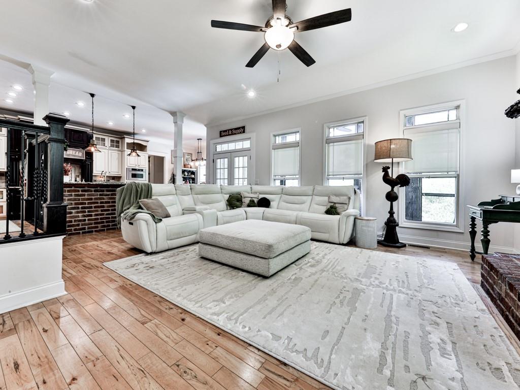 1141 Addington Lane Waleska, GA 30183 - Photo 22 of 105 a living room with furniture and a wooden floor
