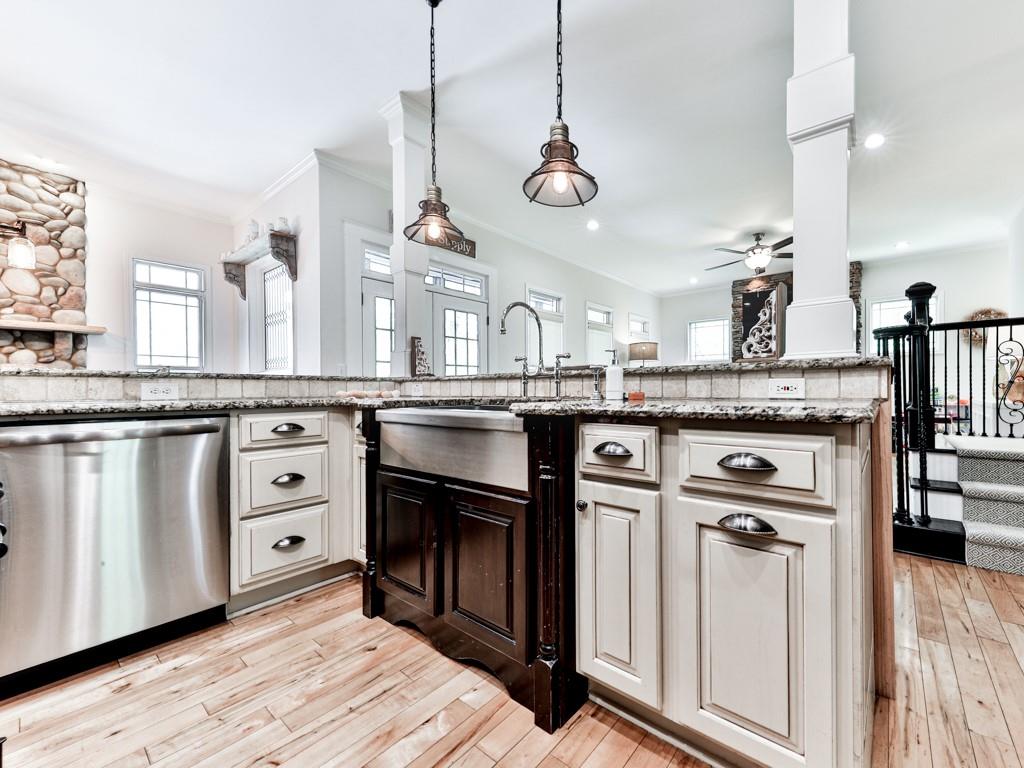 1141 Addington Lane Waleska, GA 30183 - Photo 24 of 105 a kitchen with stainless steel appliances granite countertop a sink a stove and a wooden floor