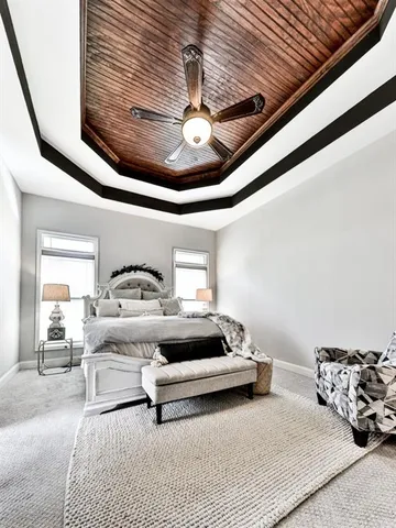 a view of a swimming pool with a table and chairs under an umbrella