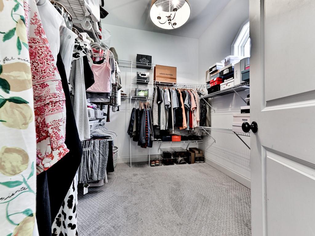 1141 Addington Lane Waleska, GA 30183 - Photo 35 of 105 a view of walk in closet with clothes and shoes