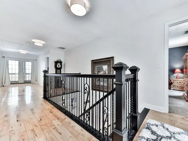 a front view of a house with a garden and yard