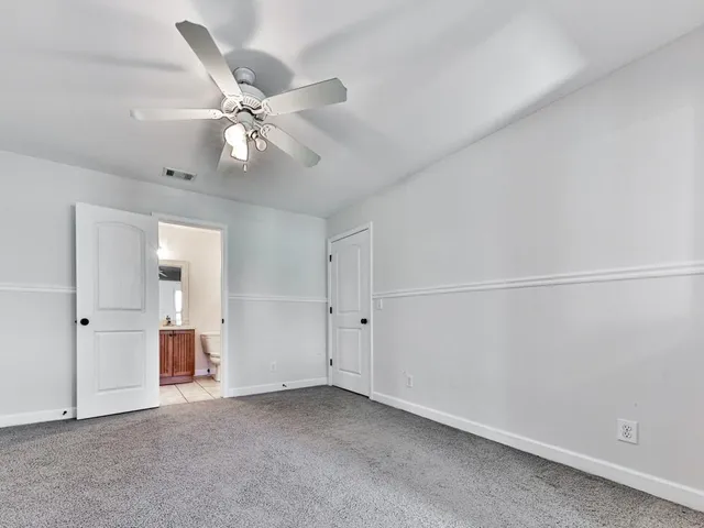 a front view of house with yard and outdoor seating