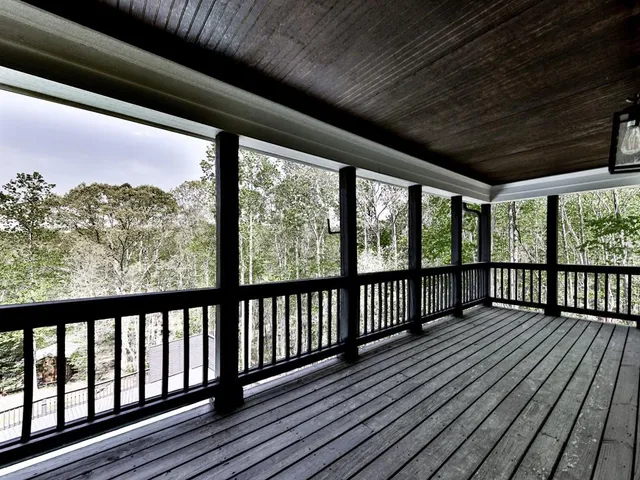 a aerial view of a house with a yard and outdoor seating