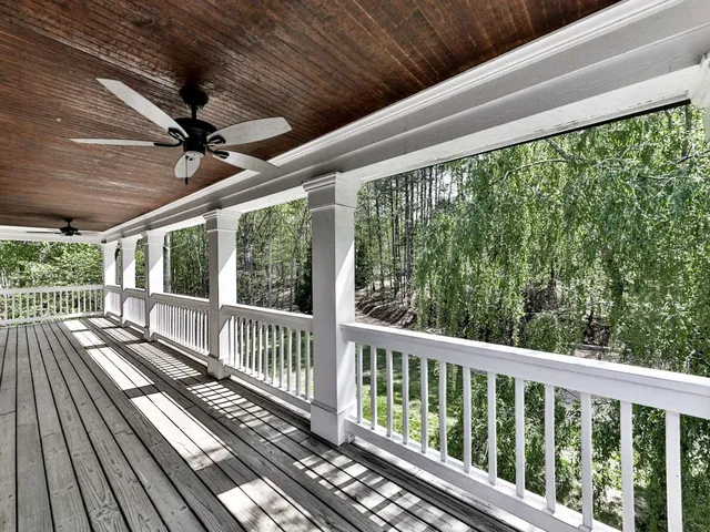 an aerial view of a house with yard