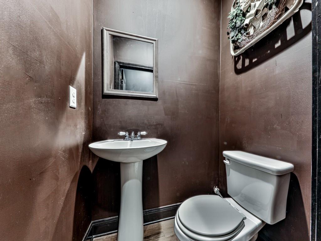 1141 Addington Lane Waleska, GA 30183 - Photo 84 of 105 a white toilet sitting next to a bathroom sink