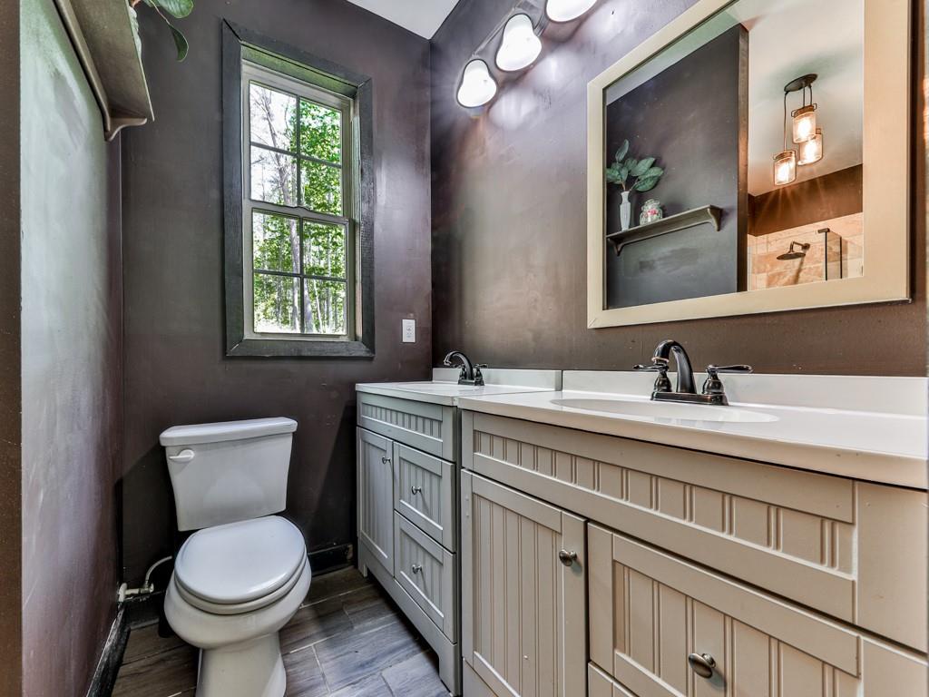1141 Addington Lane Waleska, GA 30183 - Photo 86 of 105 a bathroom with a toilet sink and mirror