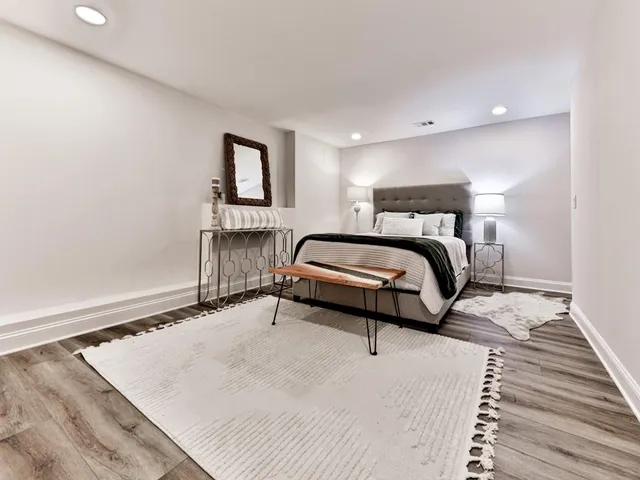 a view of entryway and hall with wooden floor