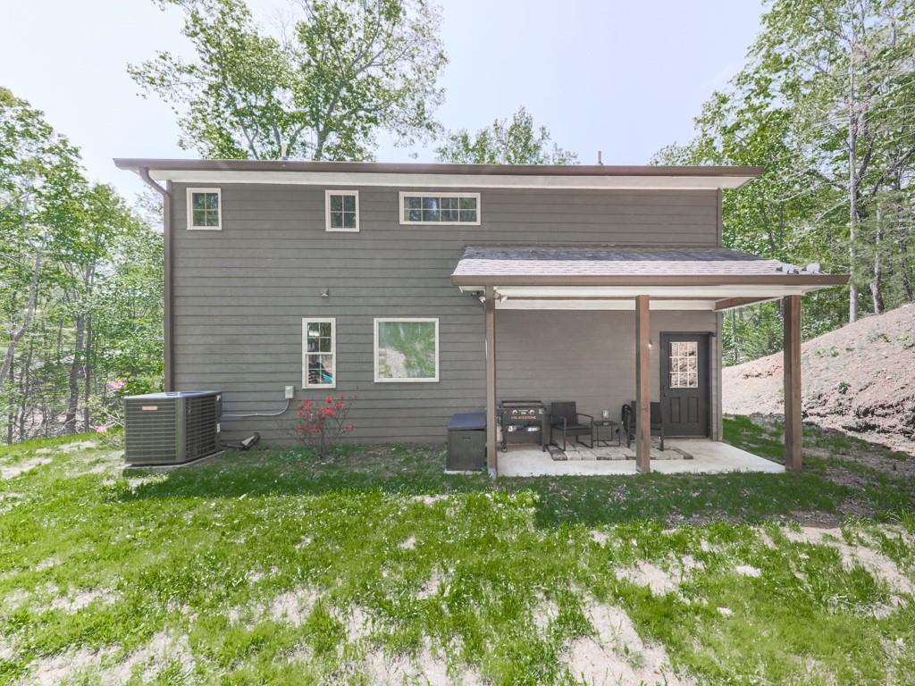 1141 Addington Lane Waleska, GA 30183 - Photo 100 of 105 a front view of house with yard and outdoor seating
