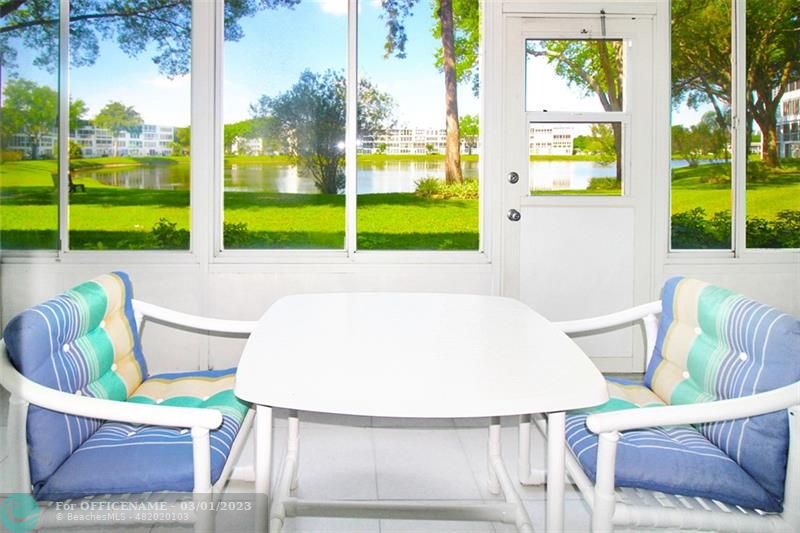 1055 Cambridge C, Unit 1055 Deerfield Beach, FL 33442 - Photo 18 of 52 a view of a dining room with furniture a chandelier and bathtub