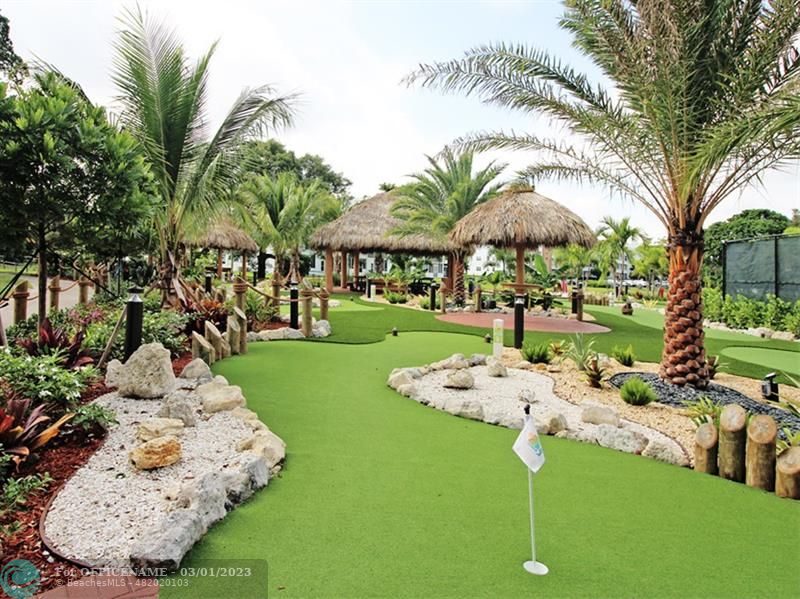 1055 Cambridge C, Unit 1055 Deerfield Beach, FL 33442 - Photo 43 of 52 a front view of a house with garden and trees