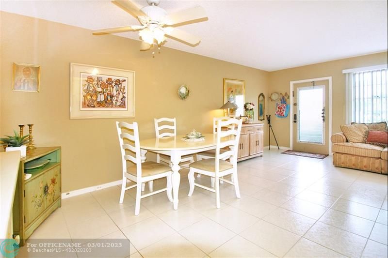 1055 Cambridge C, Unit 1055 Deerfield Beach, FL 33442 - Photo 6 of 52 a view of a livingroom with furniture and a window