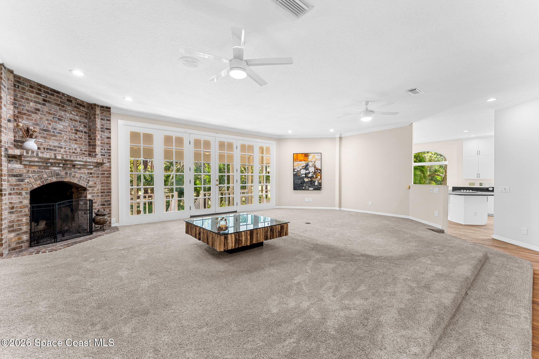 1325 Chase Hammock Road Merritt Island, FL 32953 - Photo 13 of 83 a living room with furniture and a fireplace