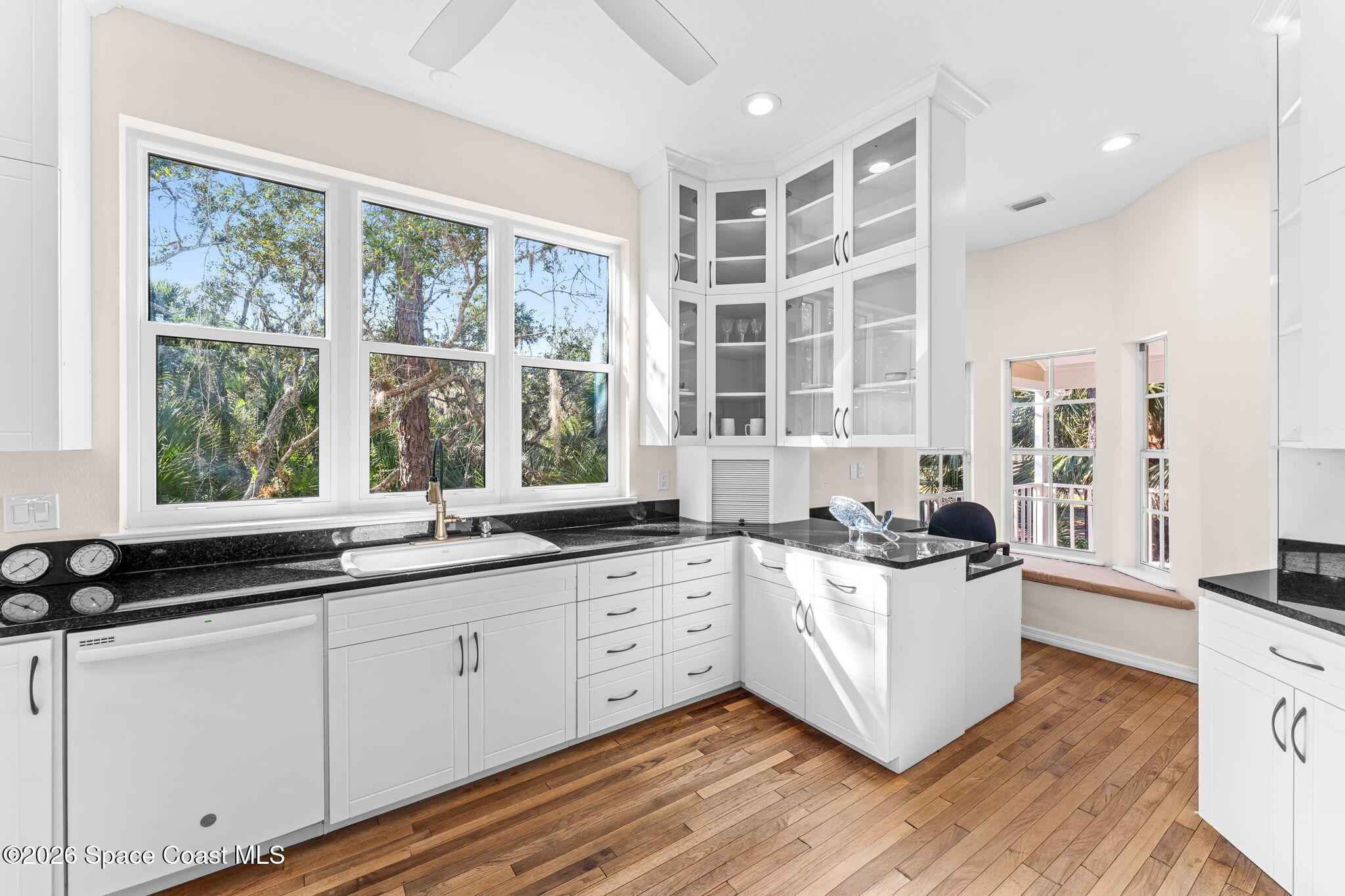 1325 Chase Hammock Road Merritt Island, FL 32953 - Photo 17 of 83 a kitchen with a sink stove and cabinets
