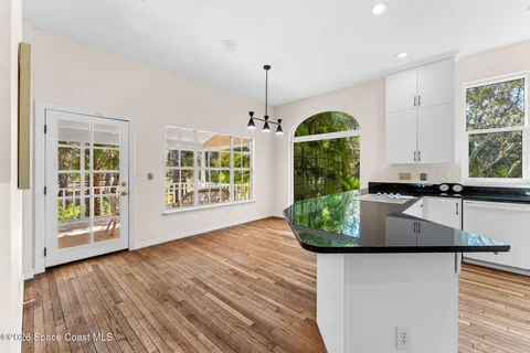 a view of kitchen with furniture and large window