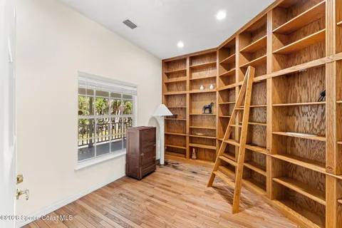 a spacious bedroom with a bed and a window