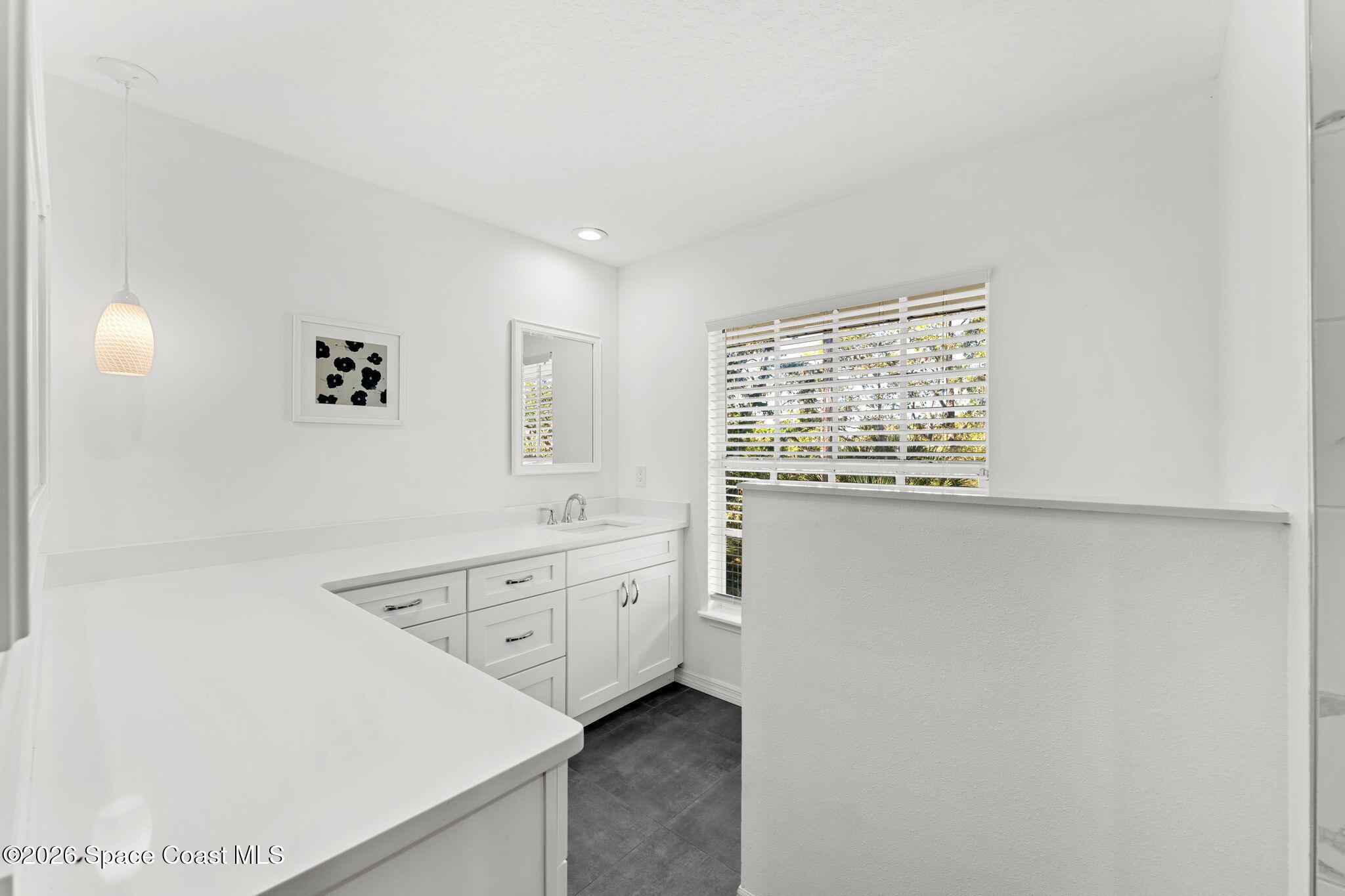 1325 Chase Hammock Road Merritt Island, FL 32953 - Photo 35 of 83 a spacious bathroom with a granite countertop sink a toilet and window