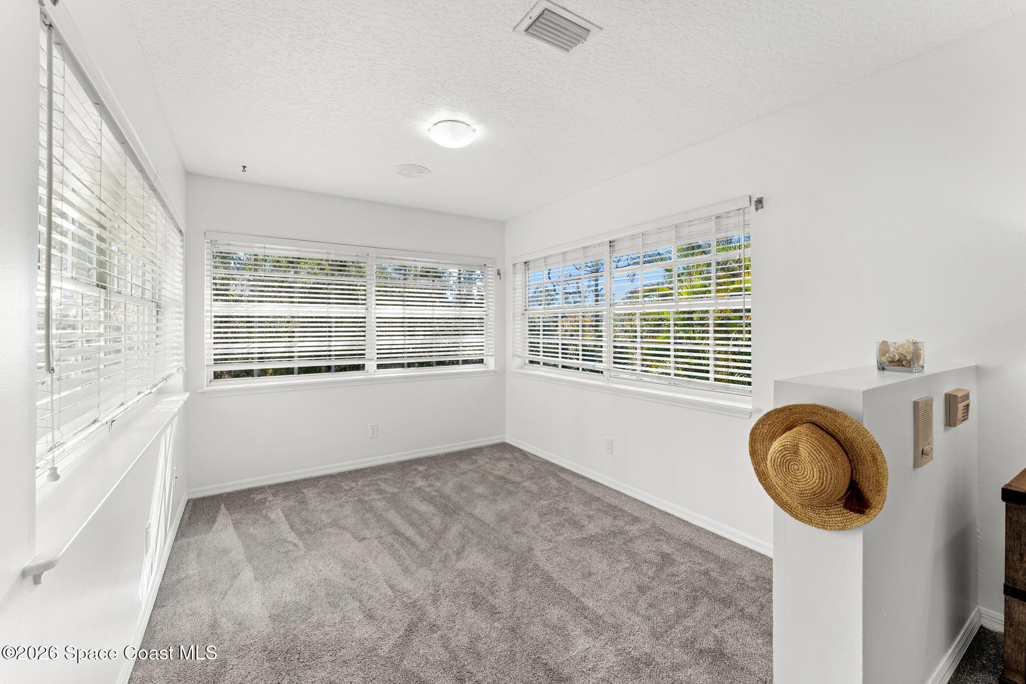 1325 Chase Hammock Road Merritt Island, FL 32953 - Photo 37 of 83 a view of empty room with wooden floor and fan