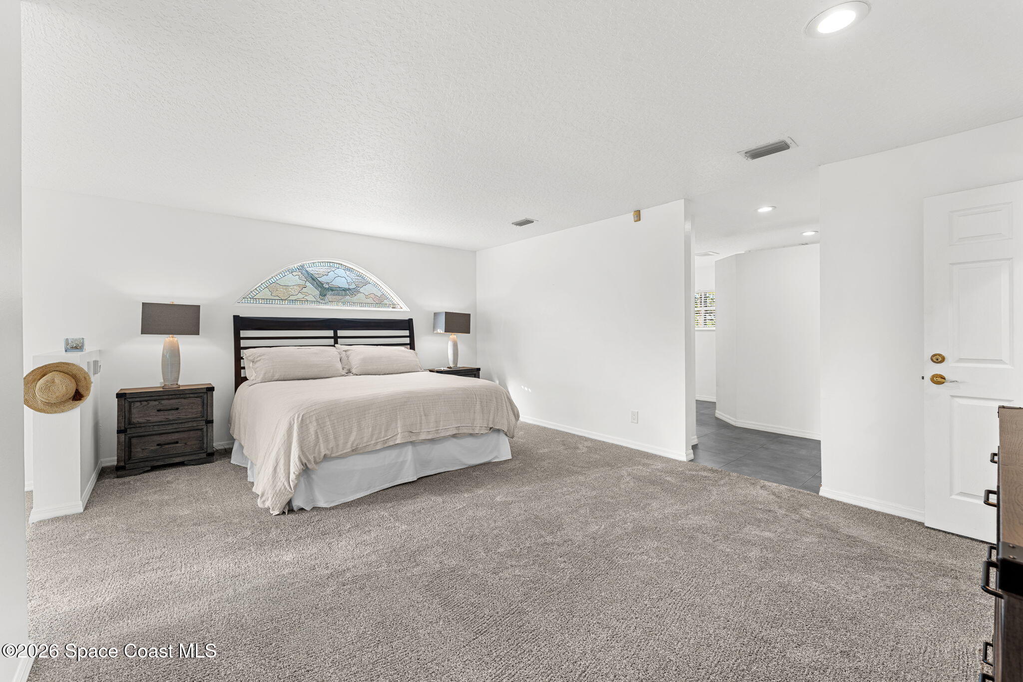 1325 Chase Hammock Road Merritt Island, FL 32953 - Photo 38 of 83 a bedroom with a bed and dresser