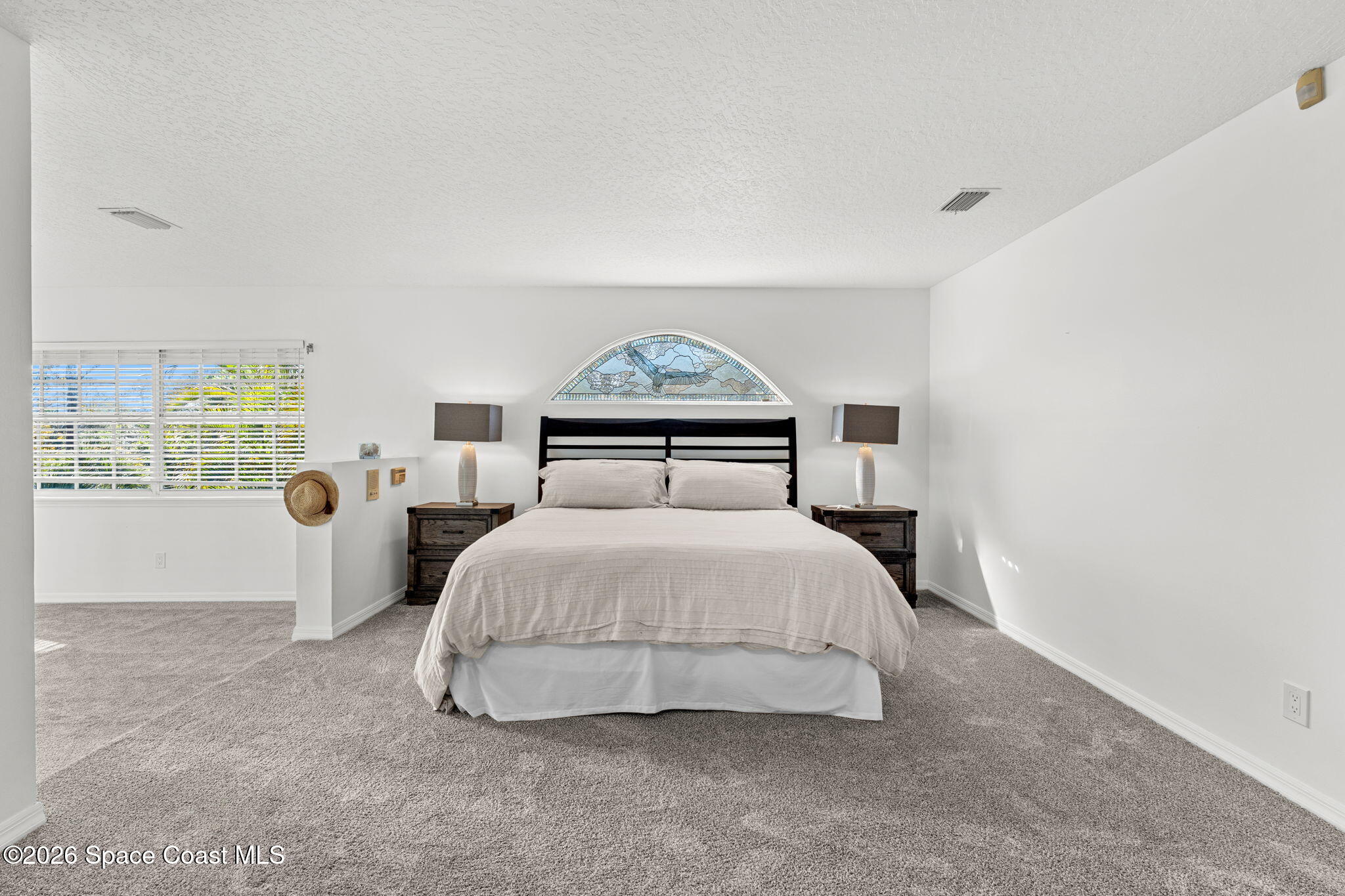 1325 Chase Hammock Road Merritt Island, FL 32953 - Photo 39 of 83 a spacious bedroom with a bed and a window