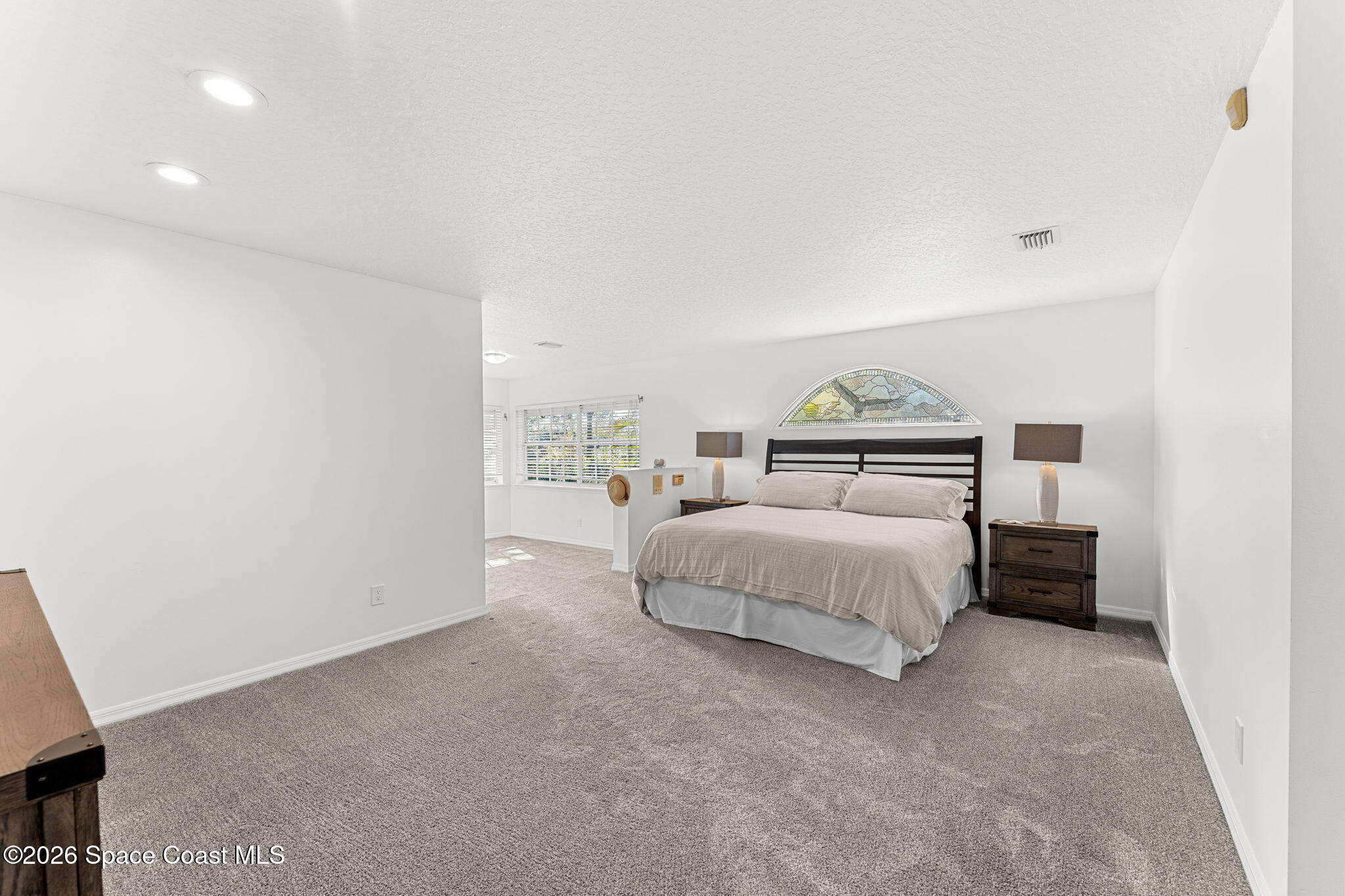 1325 Chase Hammock Road Merritt Island, FL 32953 - Photo 40 of 83 a bedroom with a bed and a night stand